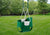 Side lifestyle view of the full bucket toddler swing by Gorilla Playsets that shows a better view of the hardware.